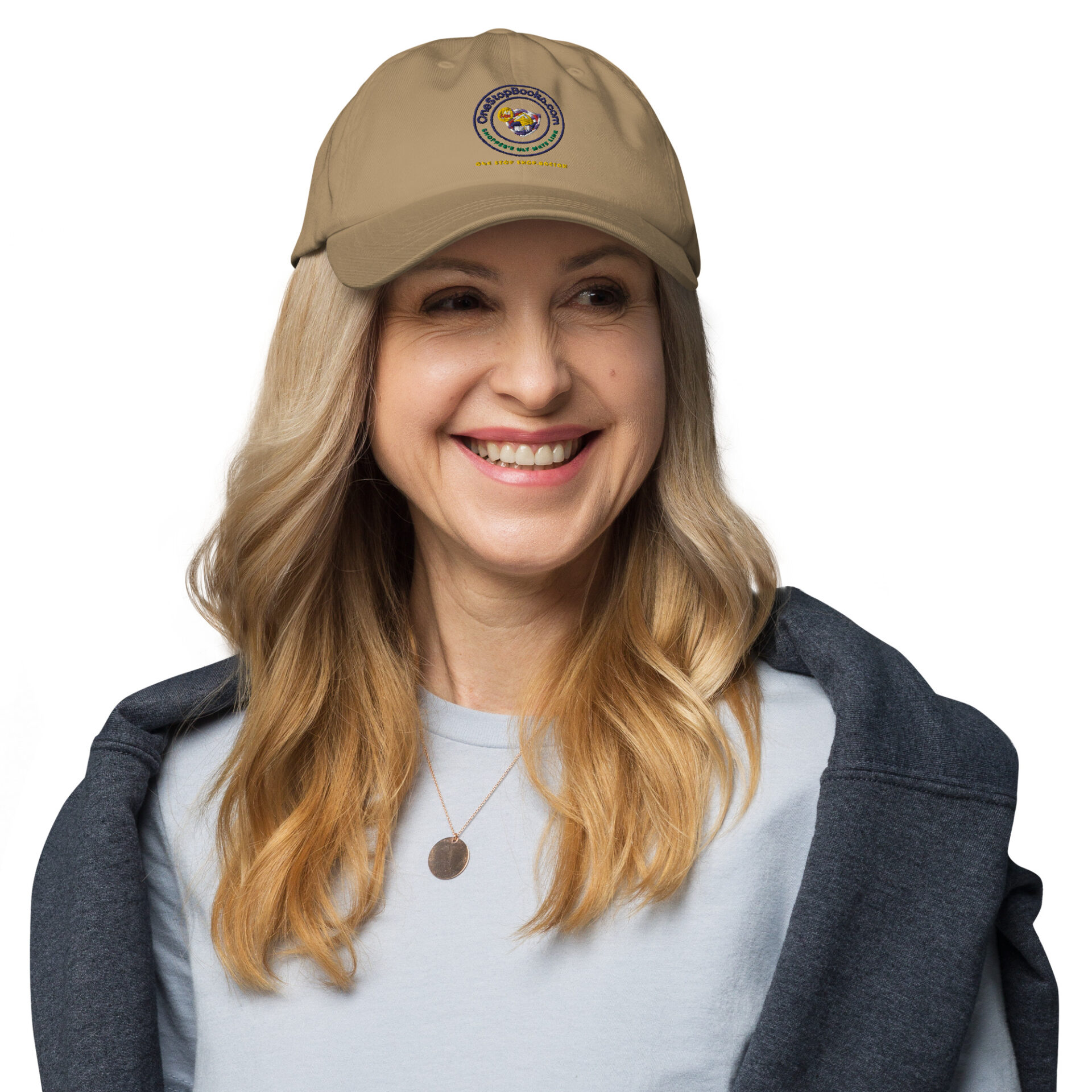 Woman smiling with a brown cap on.