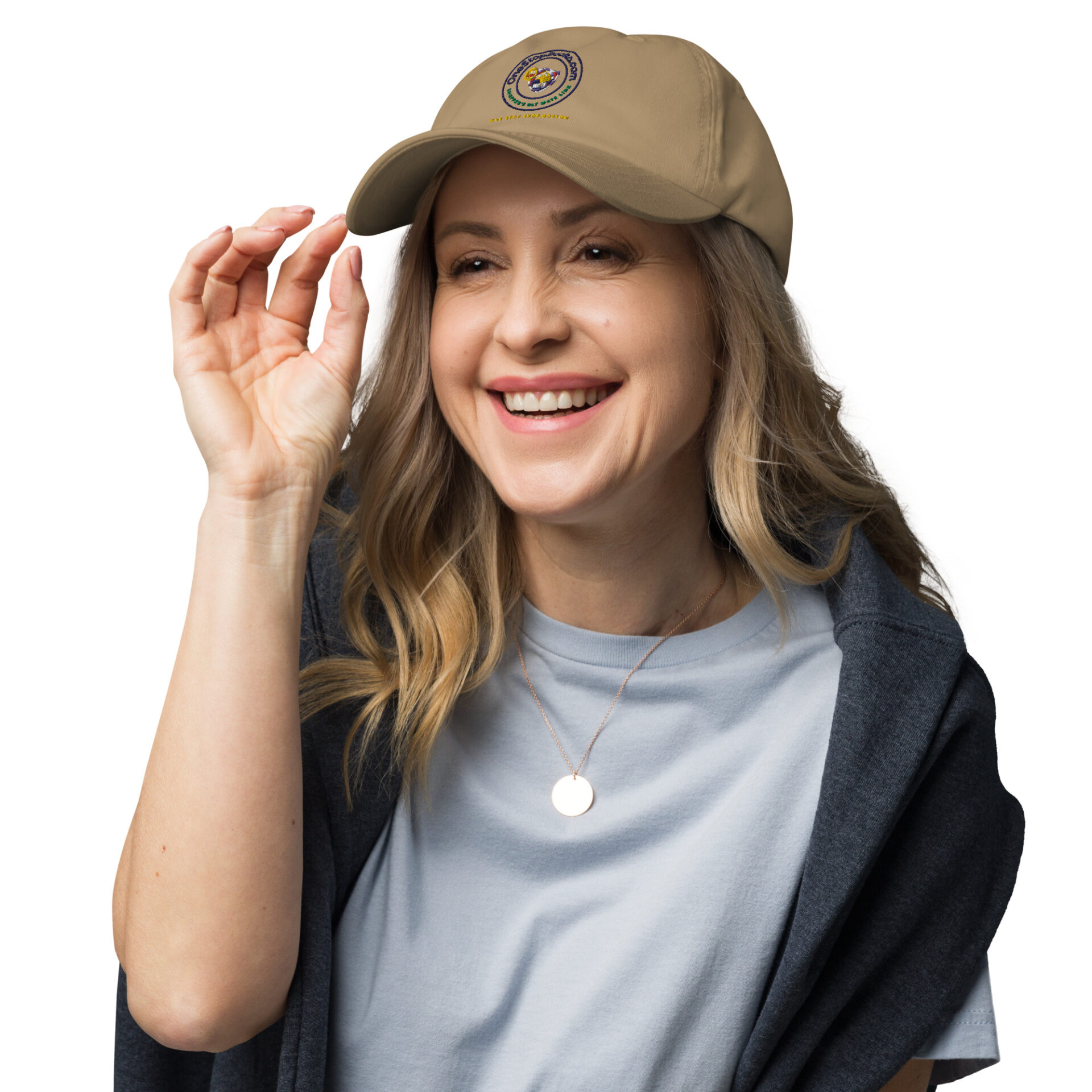 Smiling woman wearing a tan baseball cap.