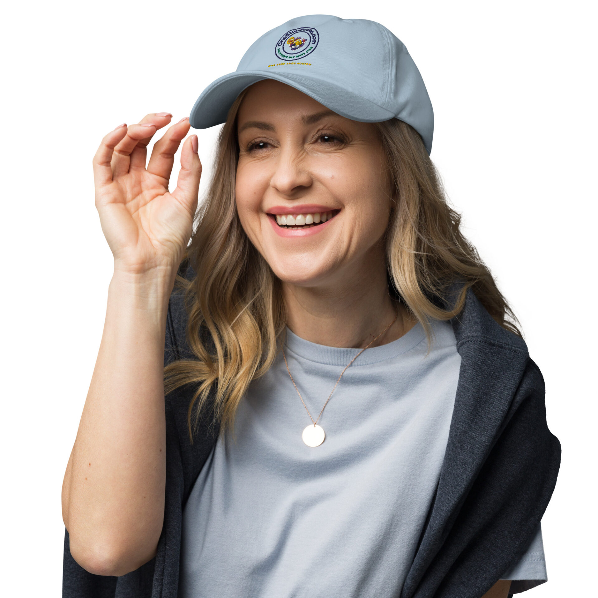 Woman smiling and wearing a blue cap.