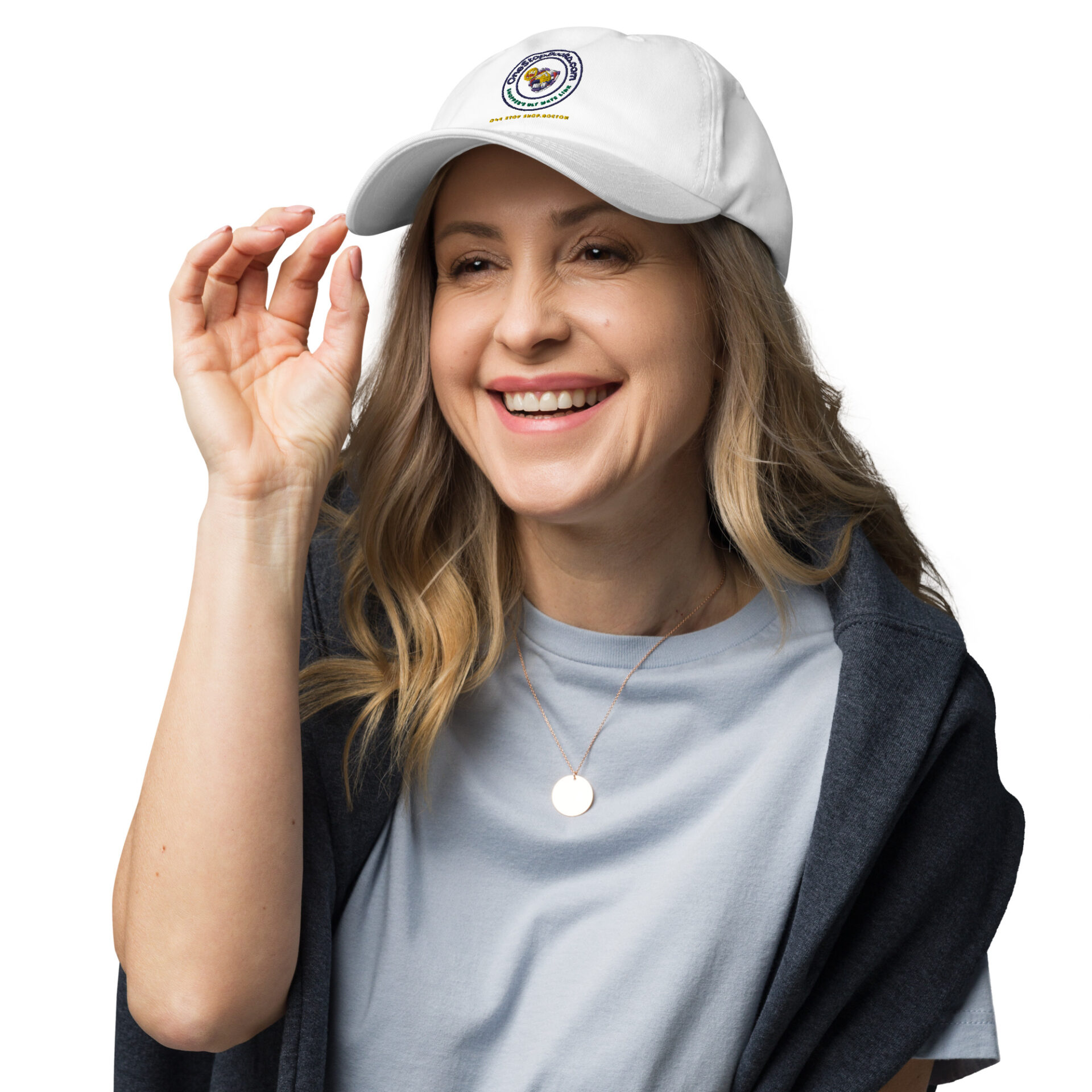 Woman smiling, wearing white cap with logo.