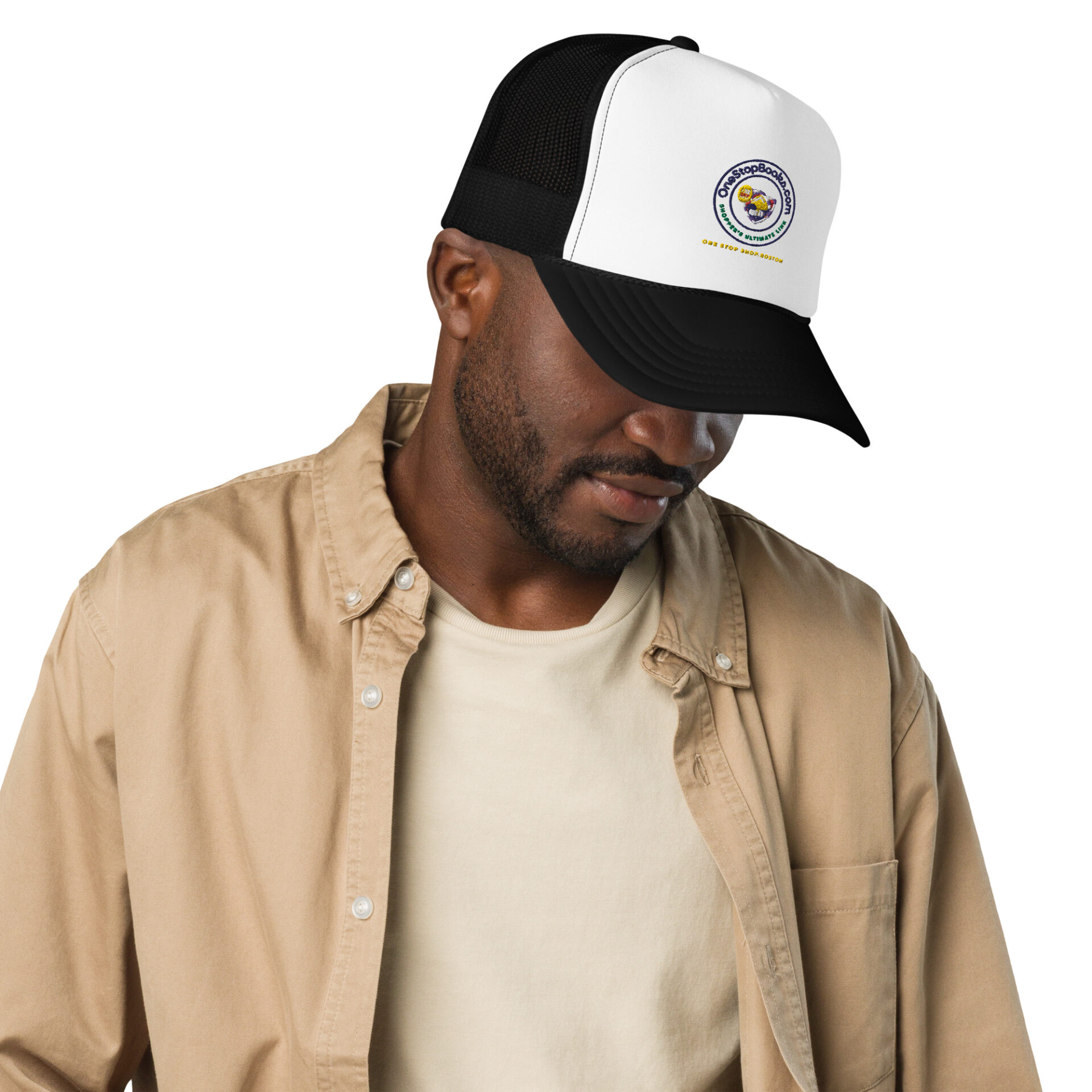 Man wearing a brown shirt and a black and white cap.