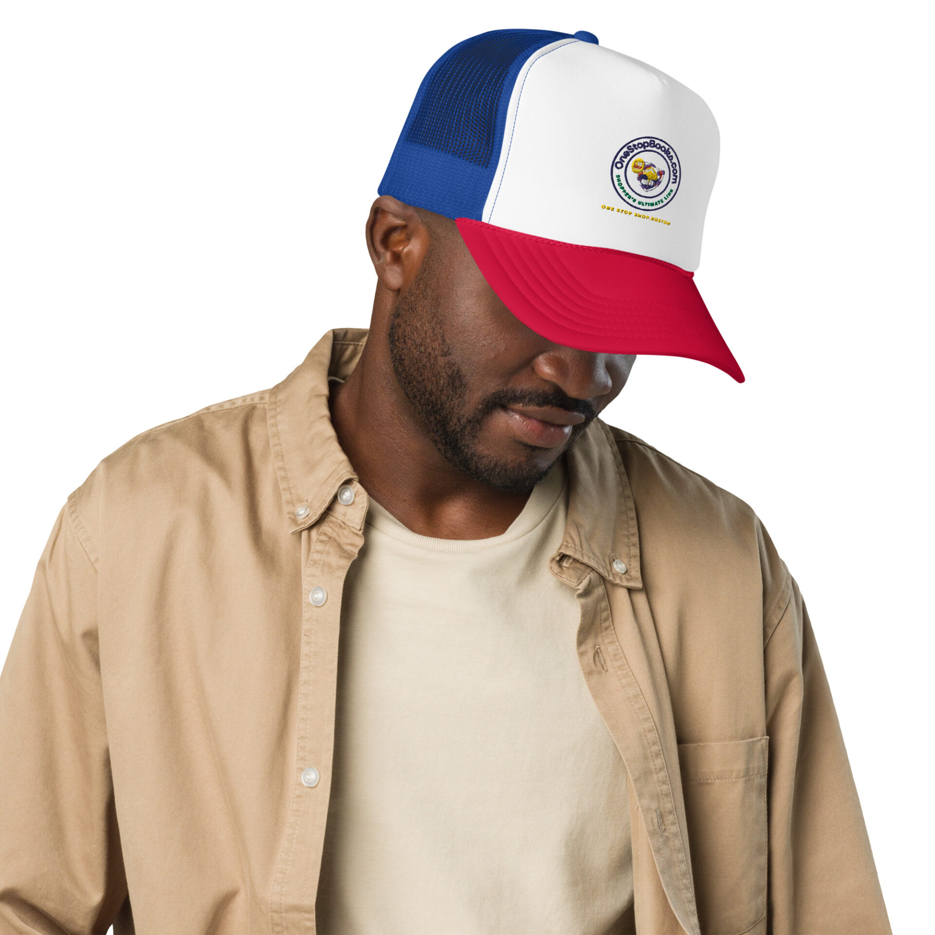 Man wearing a brown shirt and a hat.