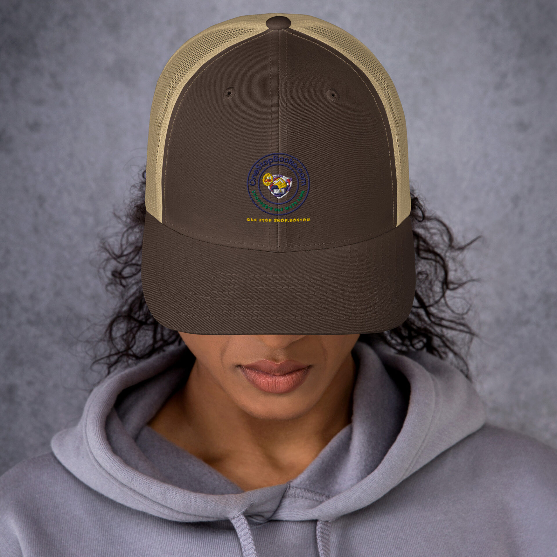 Person wearing a brown and beige cap