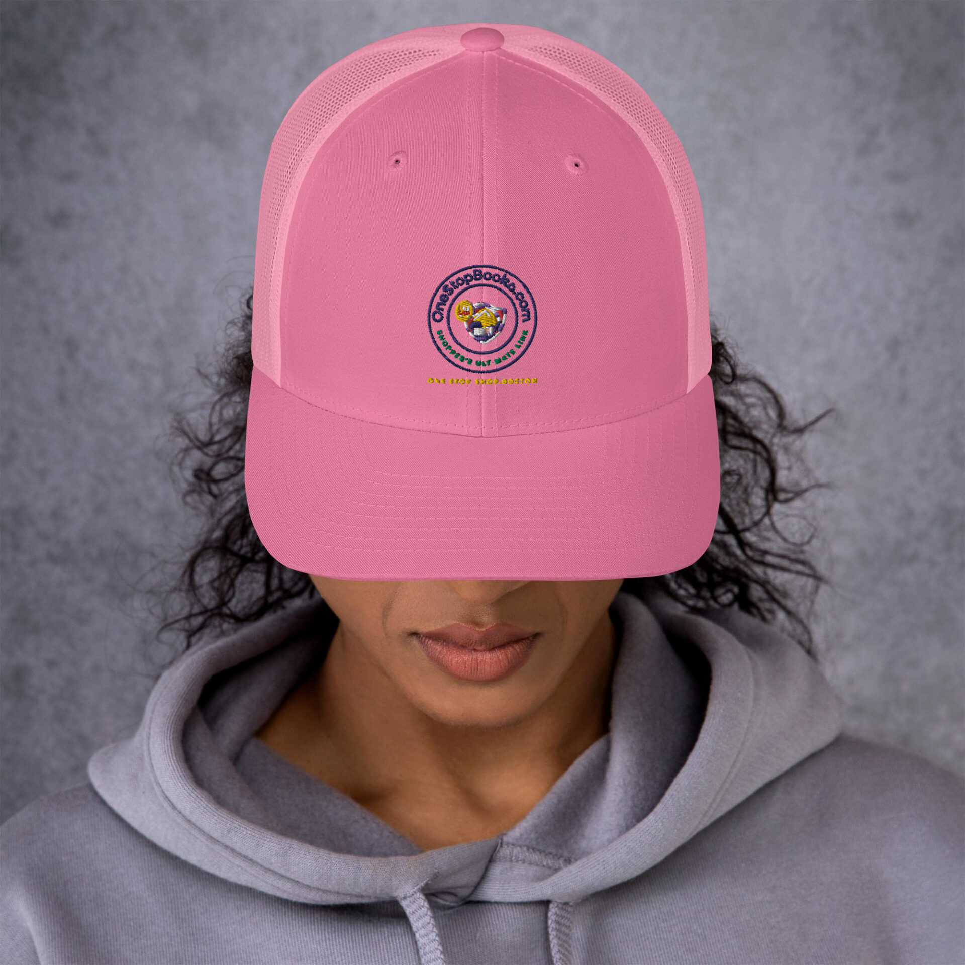 Pink hat with "One Stop Books" logo.