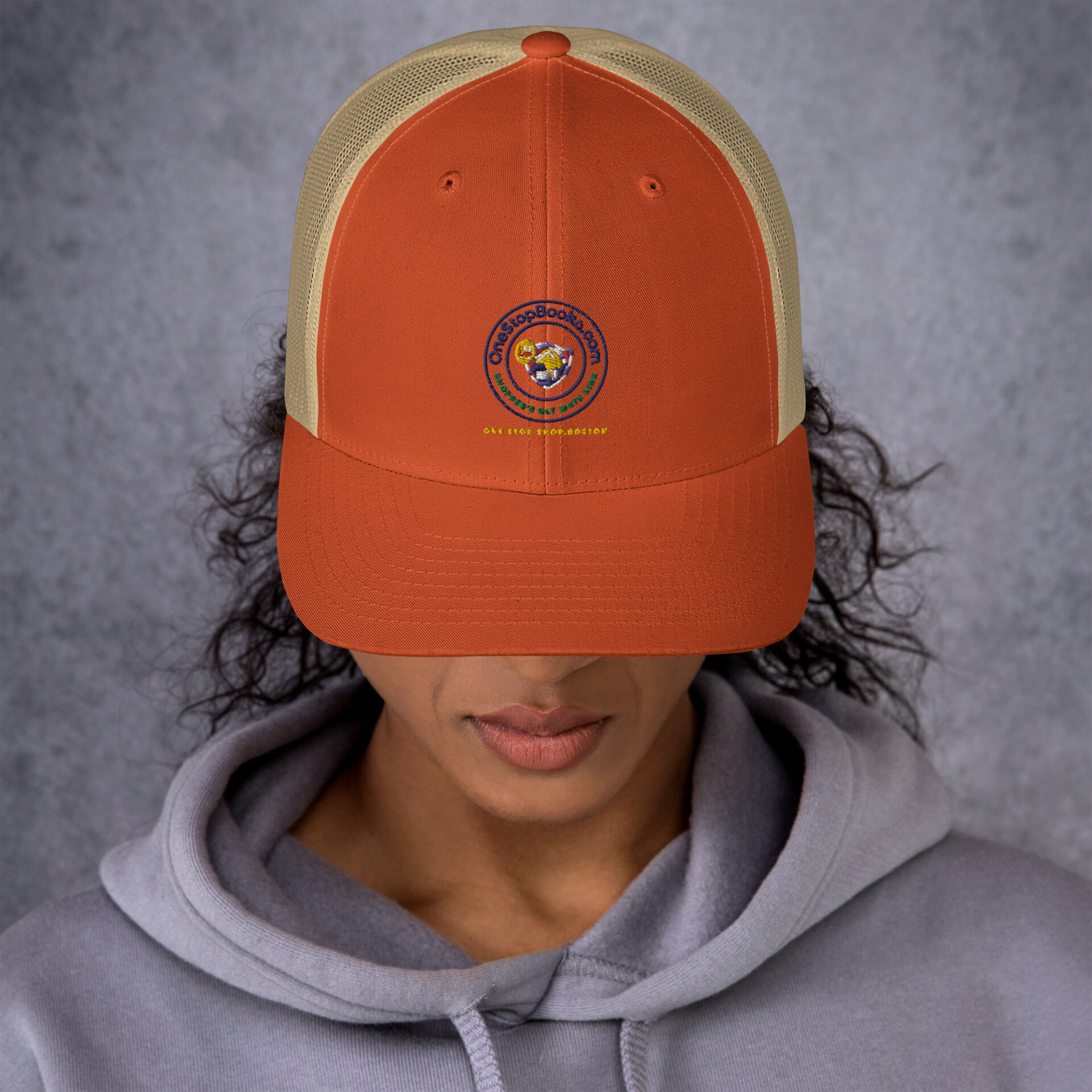 Person wearing a One Stop Bookshop hat.