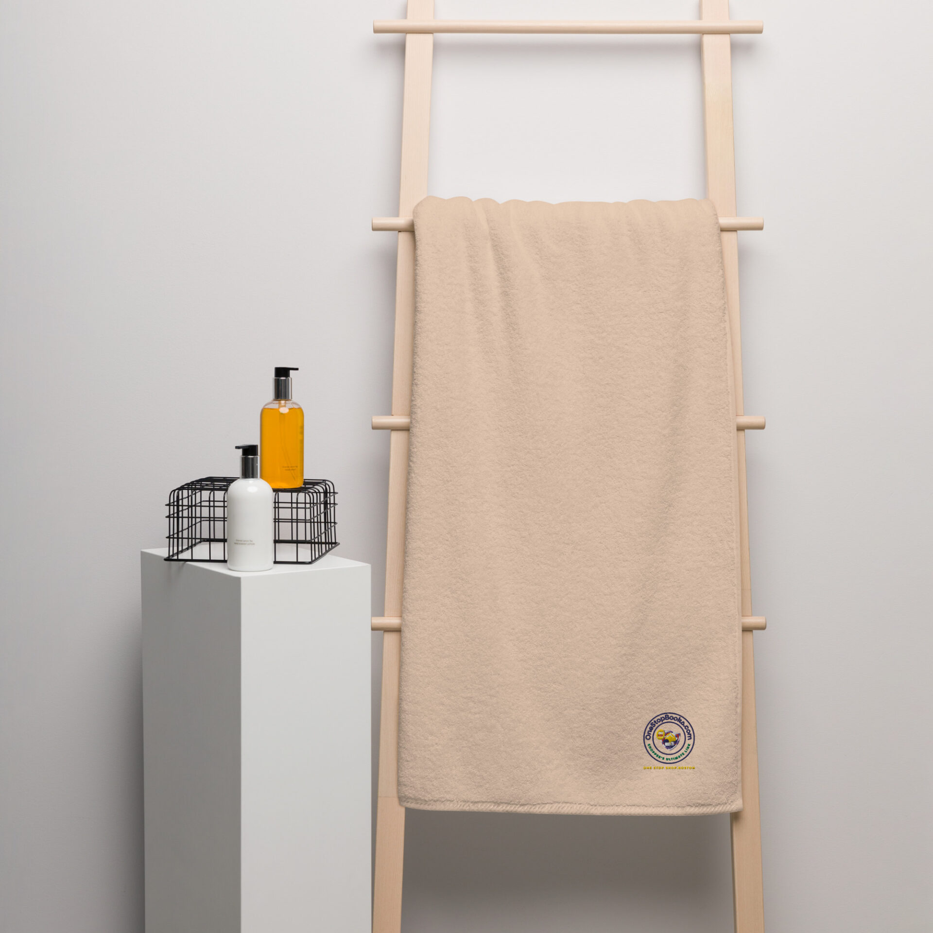 Beige towel hanging on a wooden rack.