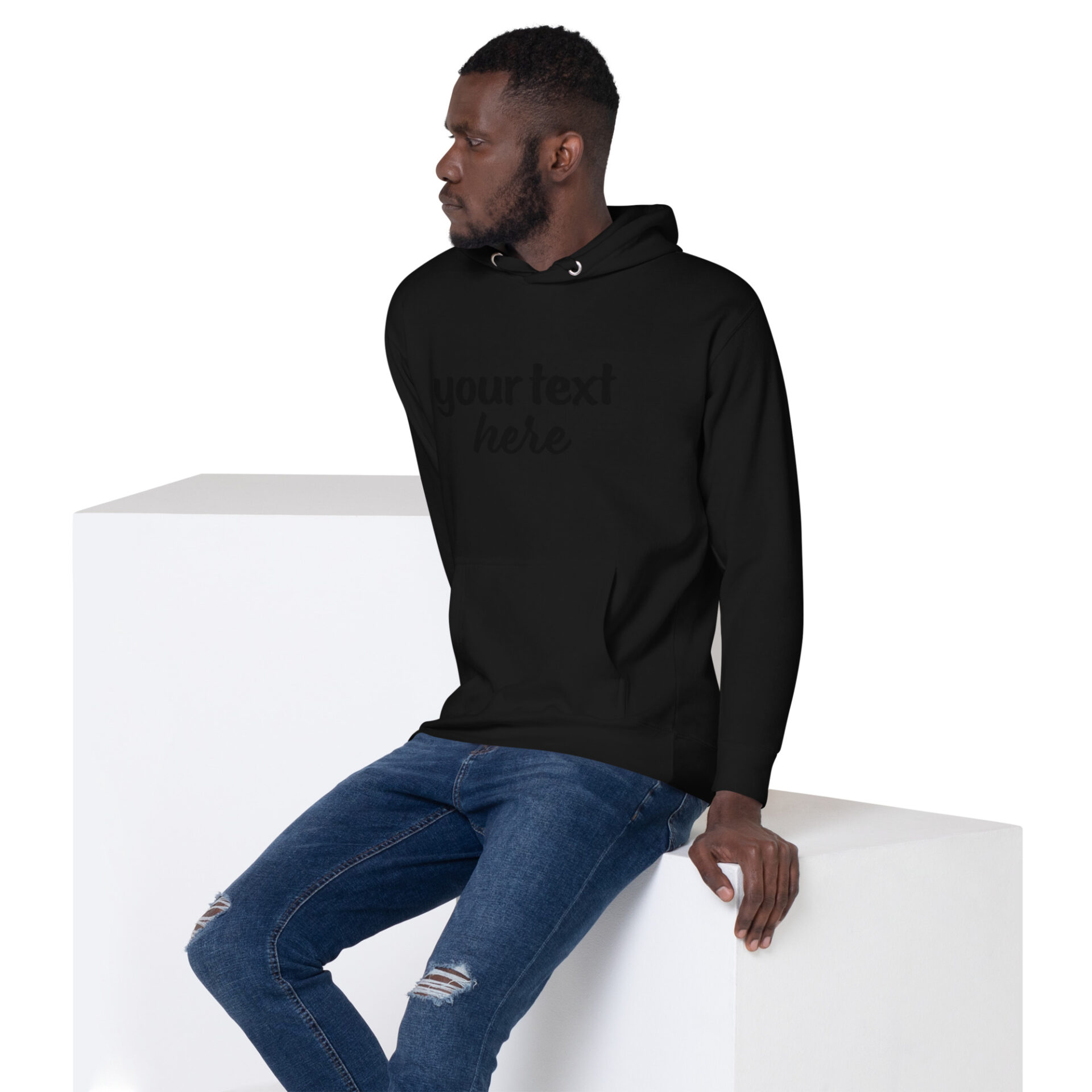 Man wearing a black hoodie with text.