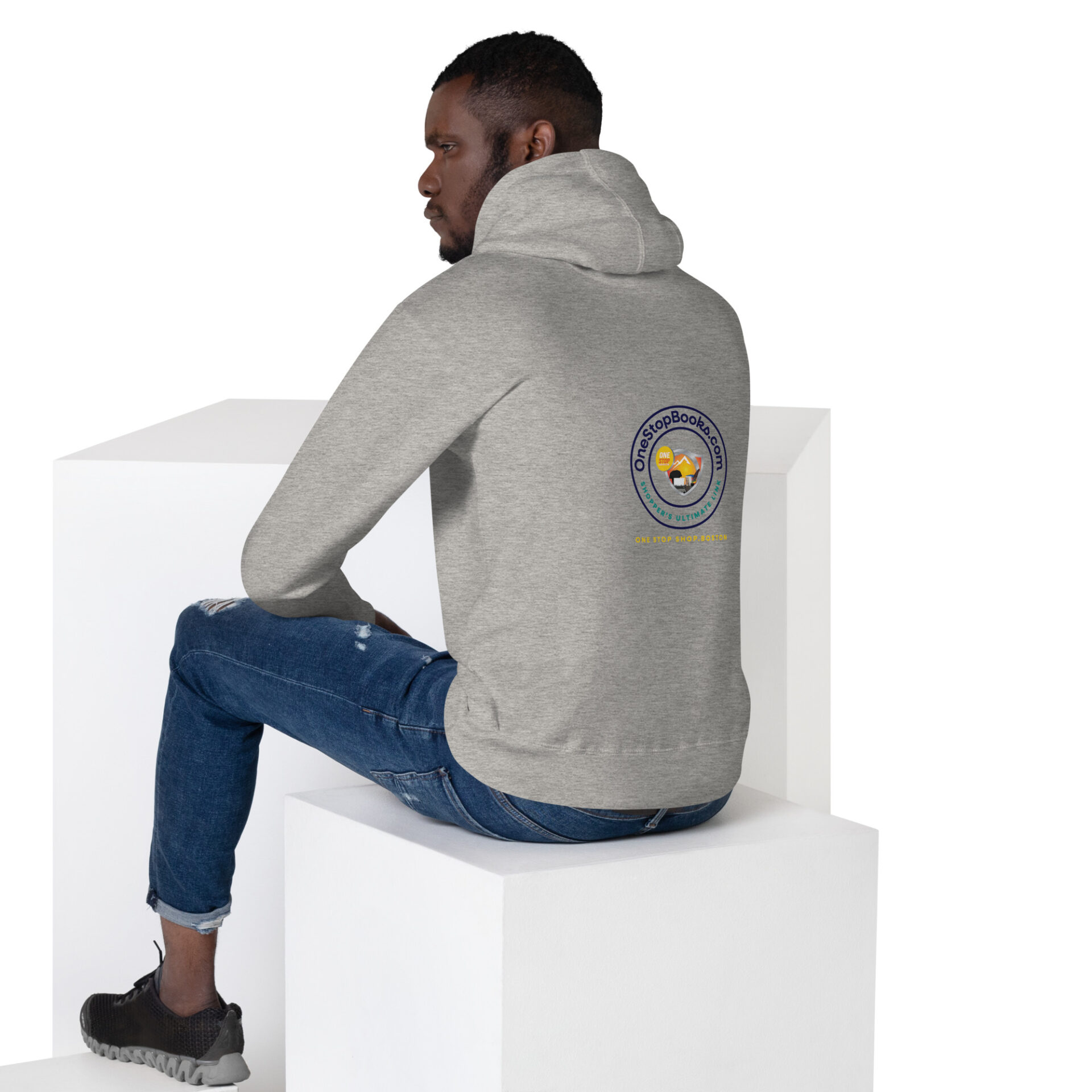 Man wearing gray hoodie with logo on back.