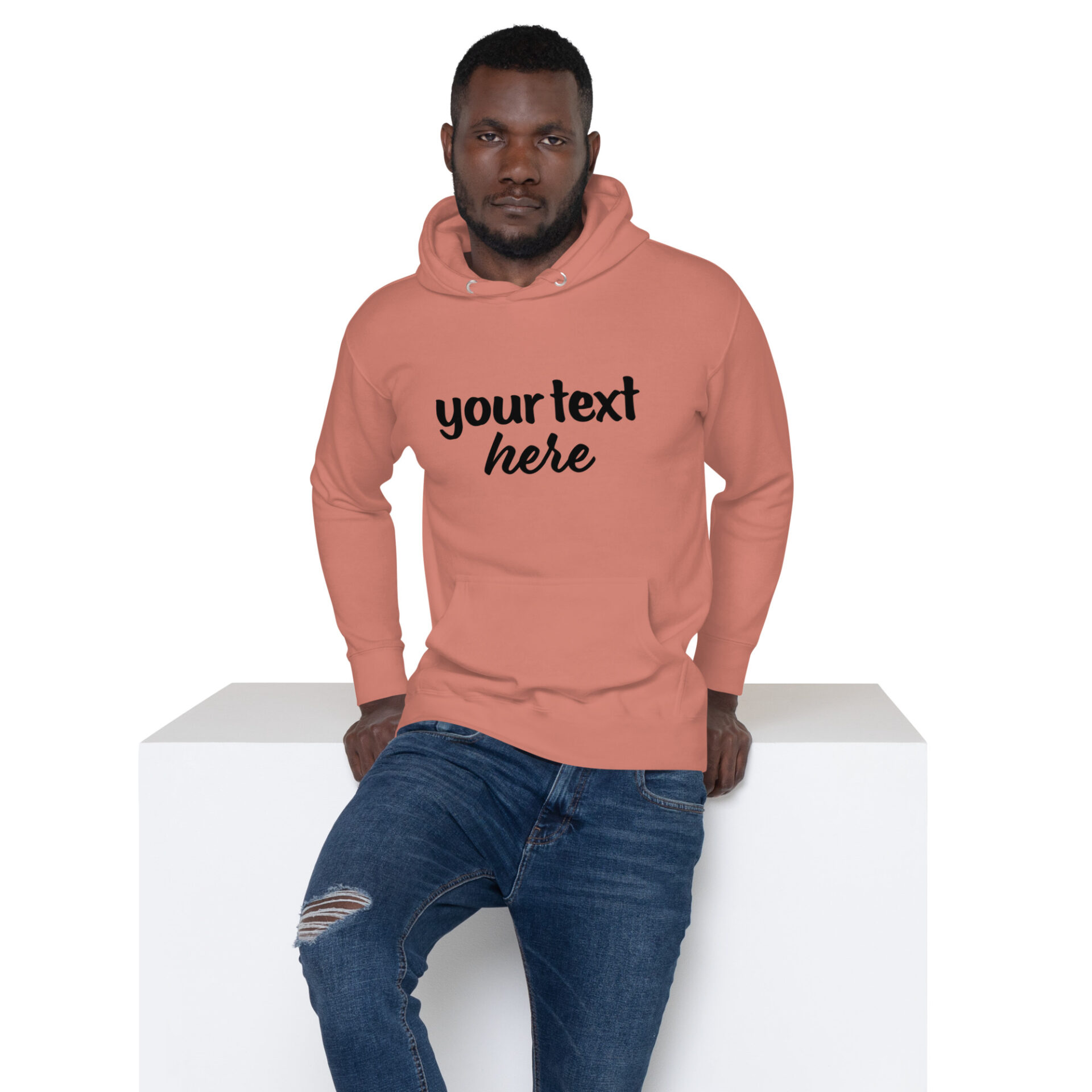 Man wearing a salmon-colored hoodie.