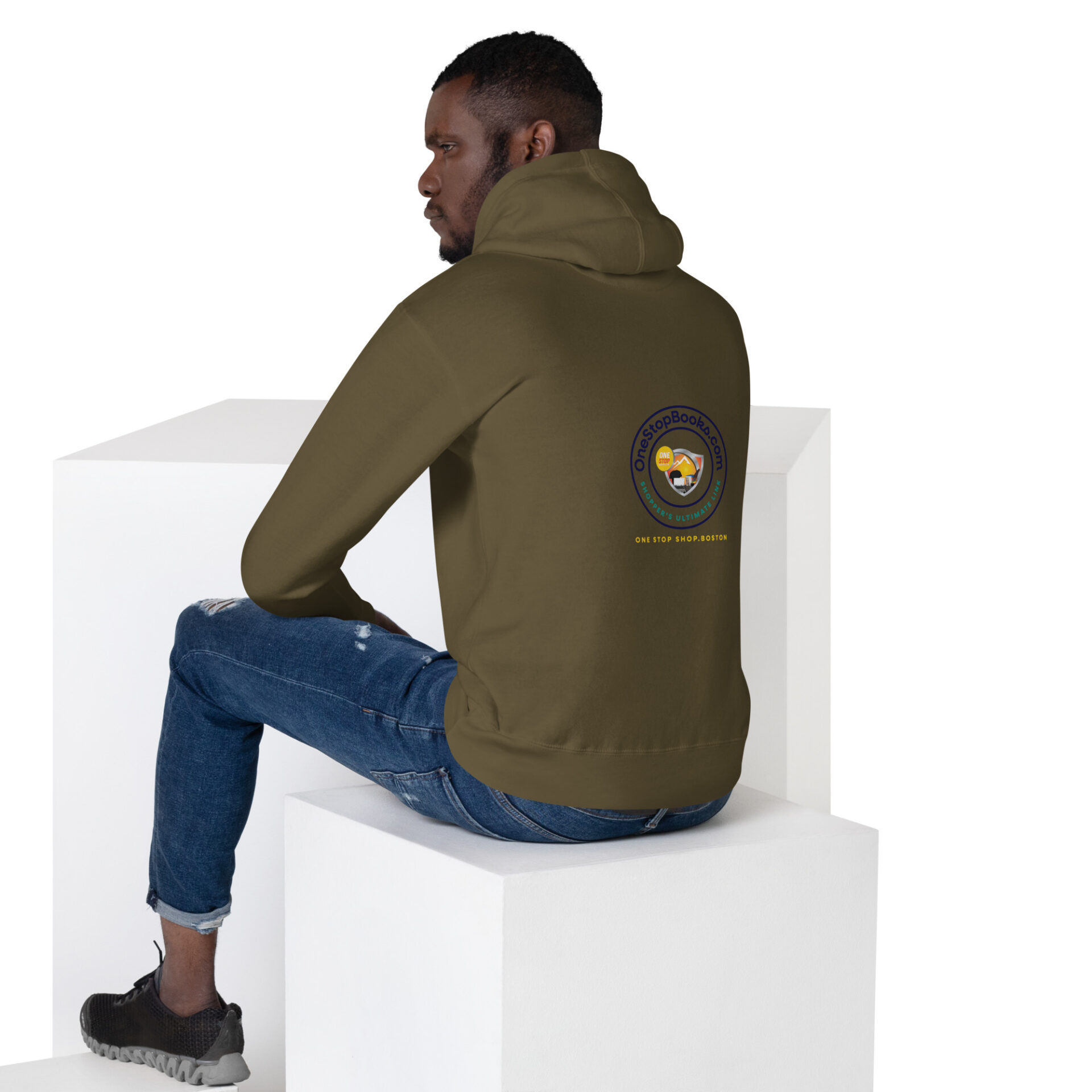 Man wearing green hoodie with logo on back.