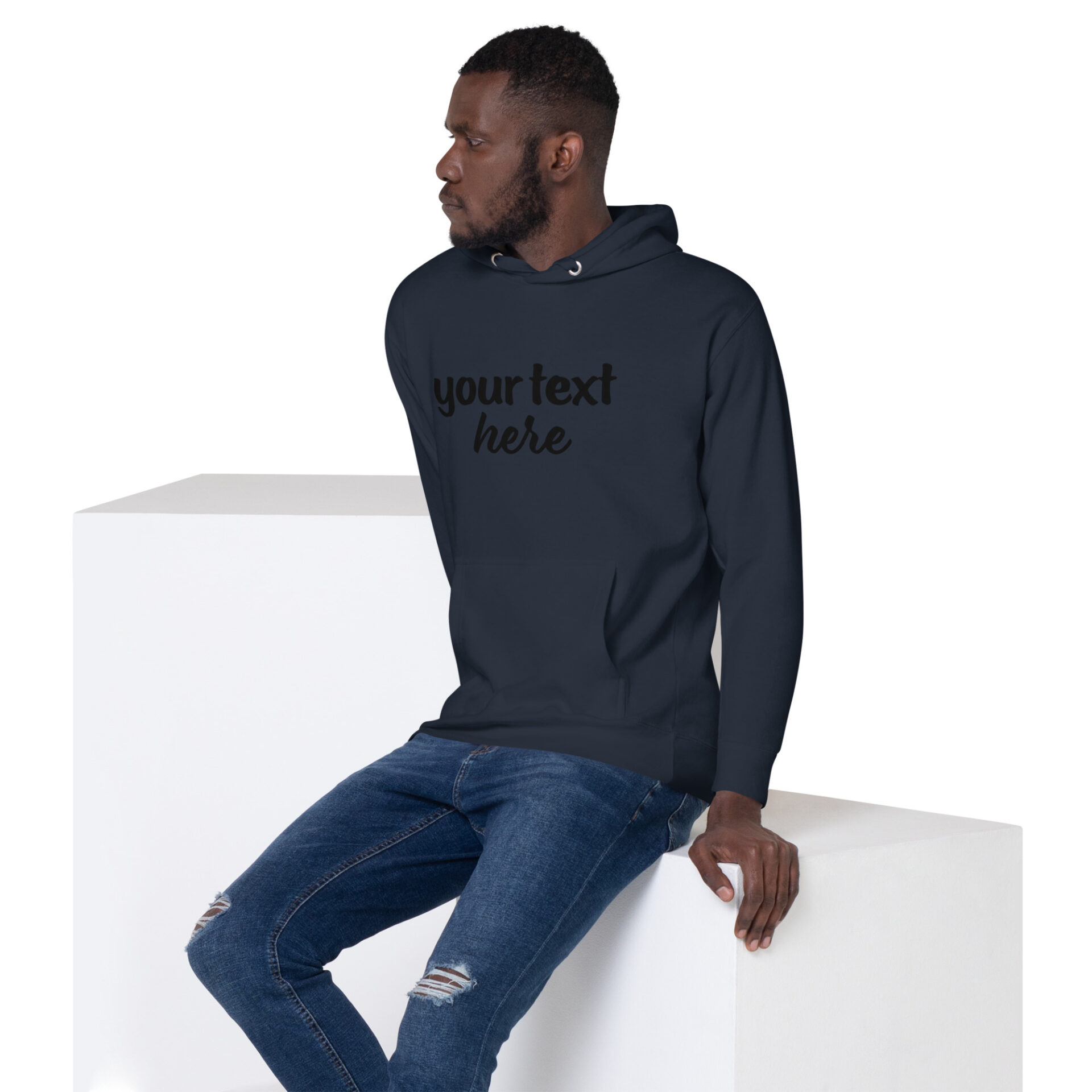 Man in dark blue hoodie with text.