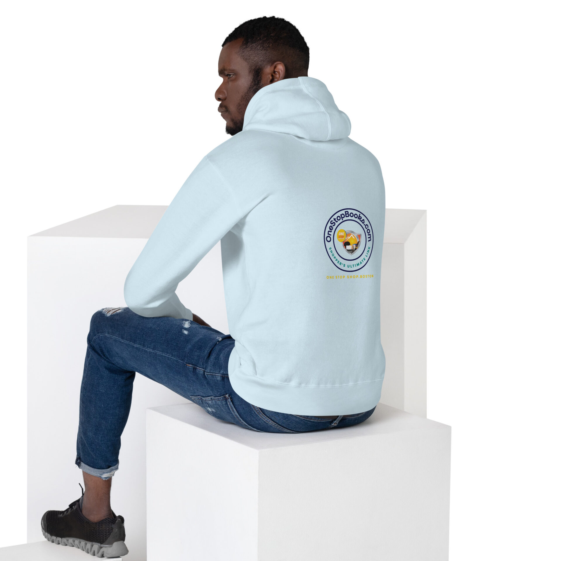 Man wearing blue hoodie with logo.