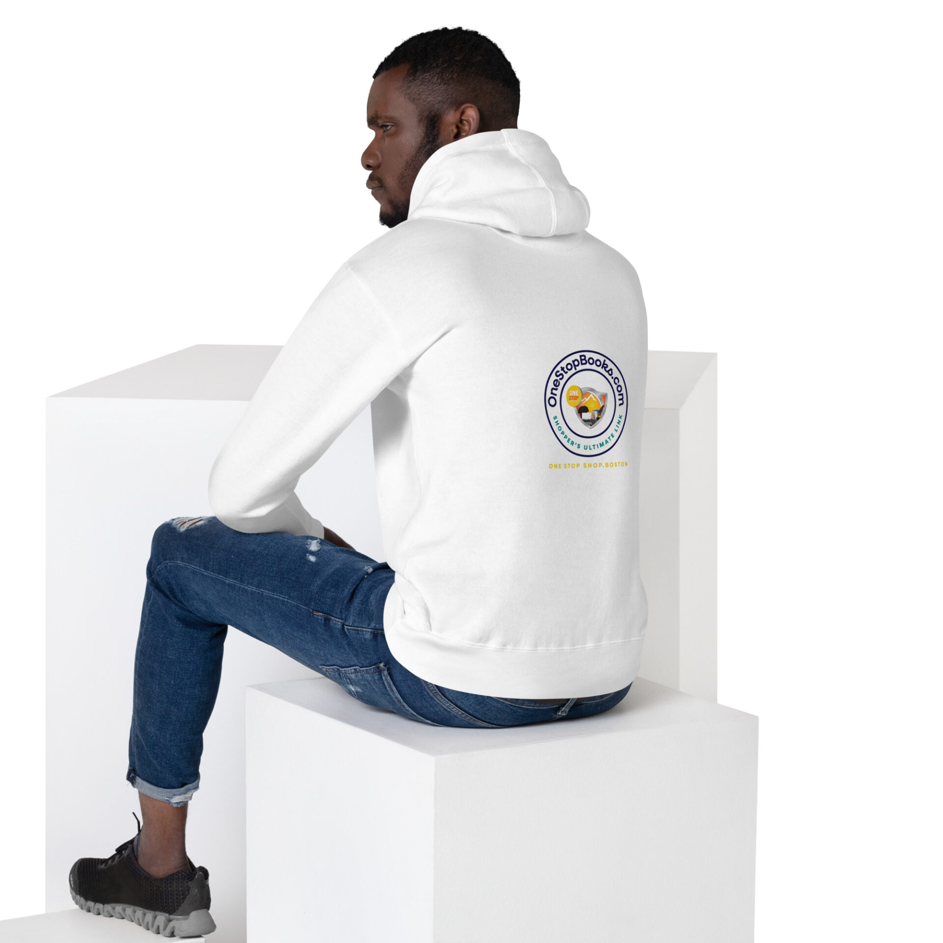 Man wearing a white hoodie with logo.