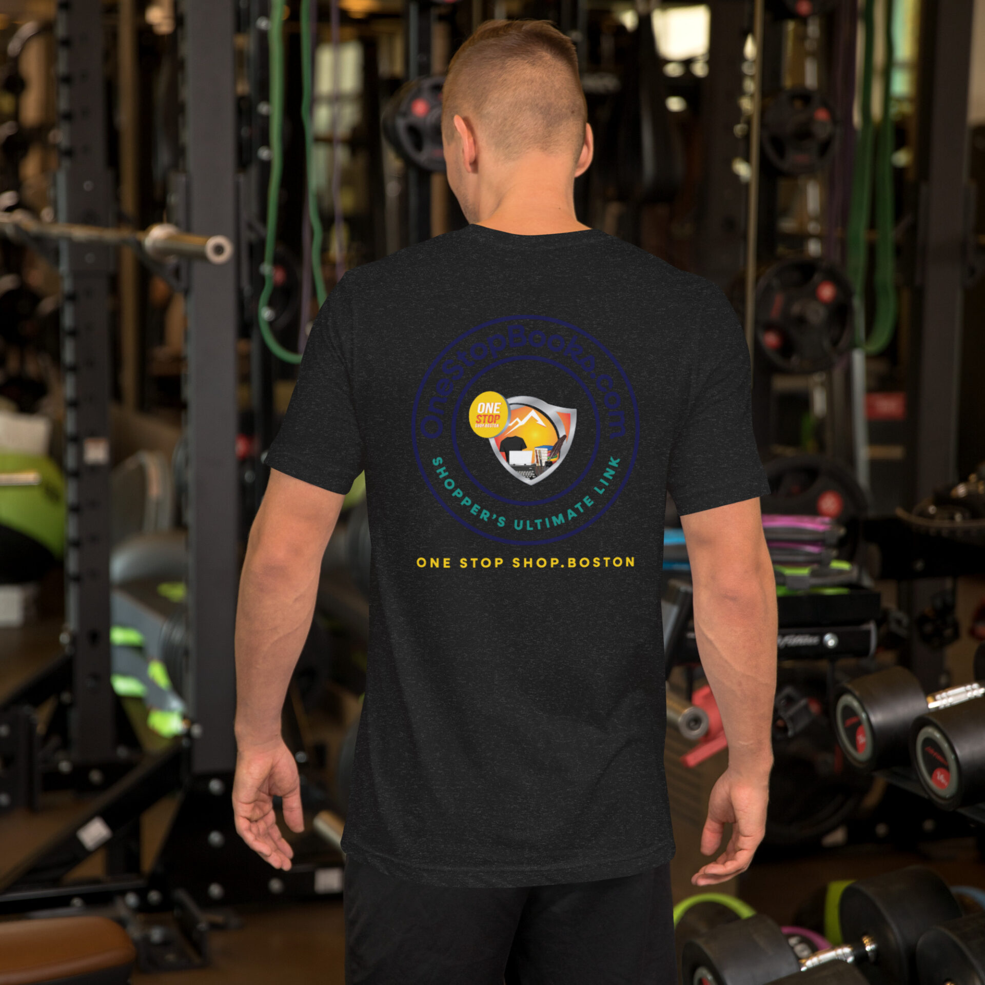 Man wearing black shirt with logo in gym.