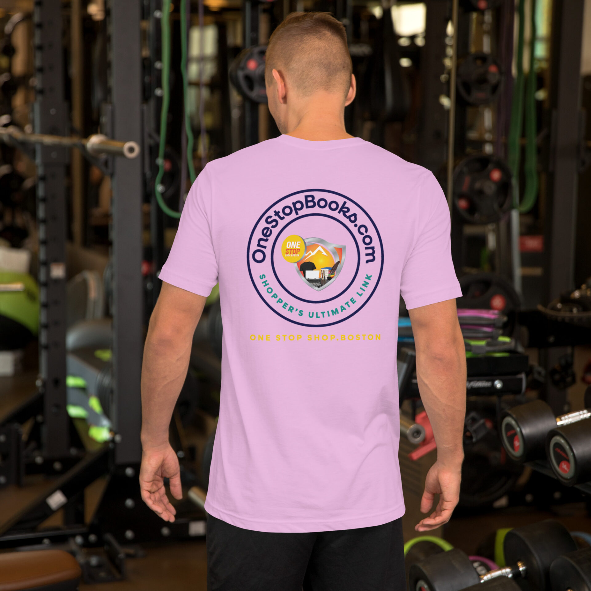 Man wearing pink OneStopBooks.com T-shirt.