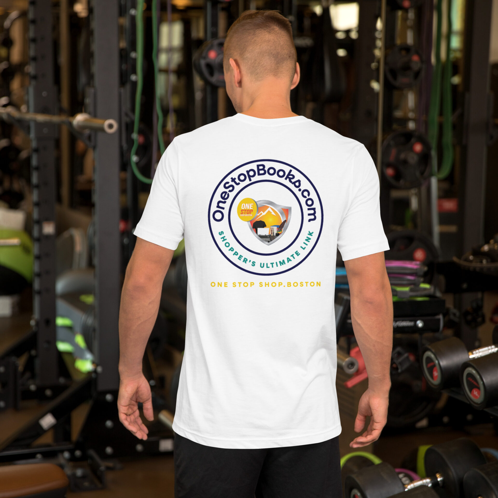 Man wearing a white t-shirt with a logo.