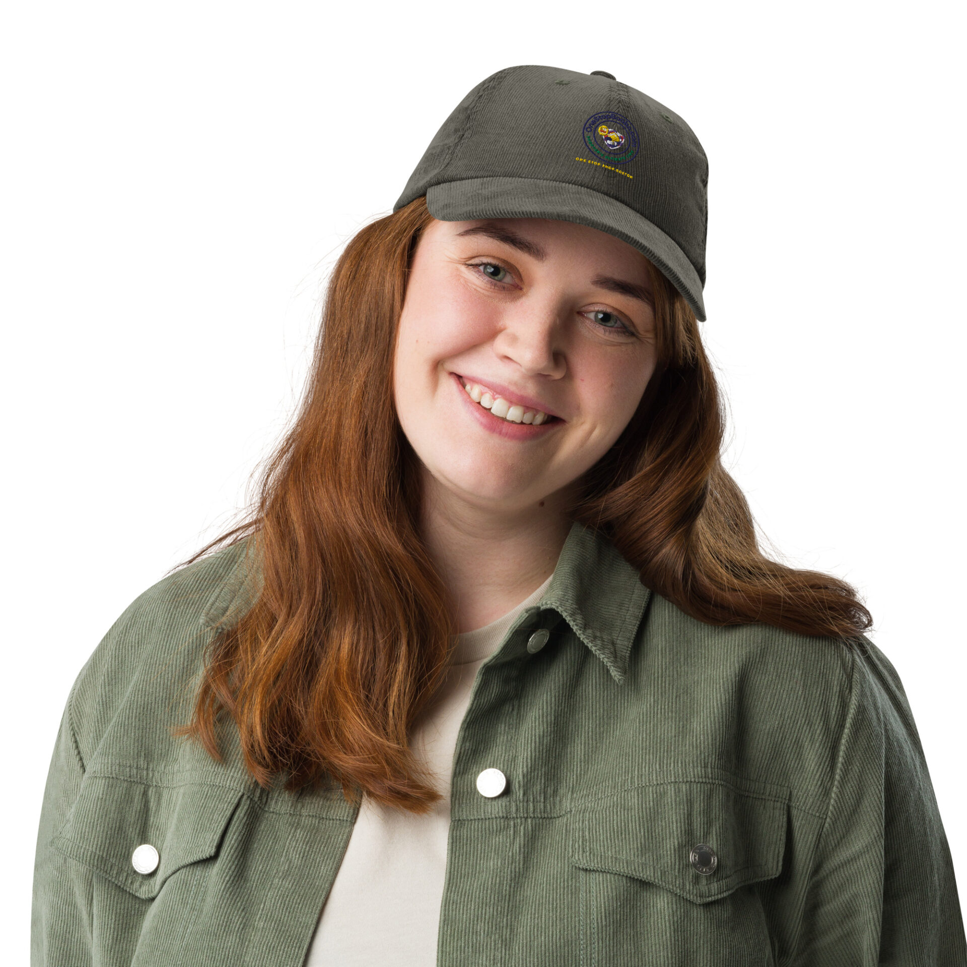 Smiling woman wearing green corduroy jacket and cap.