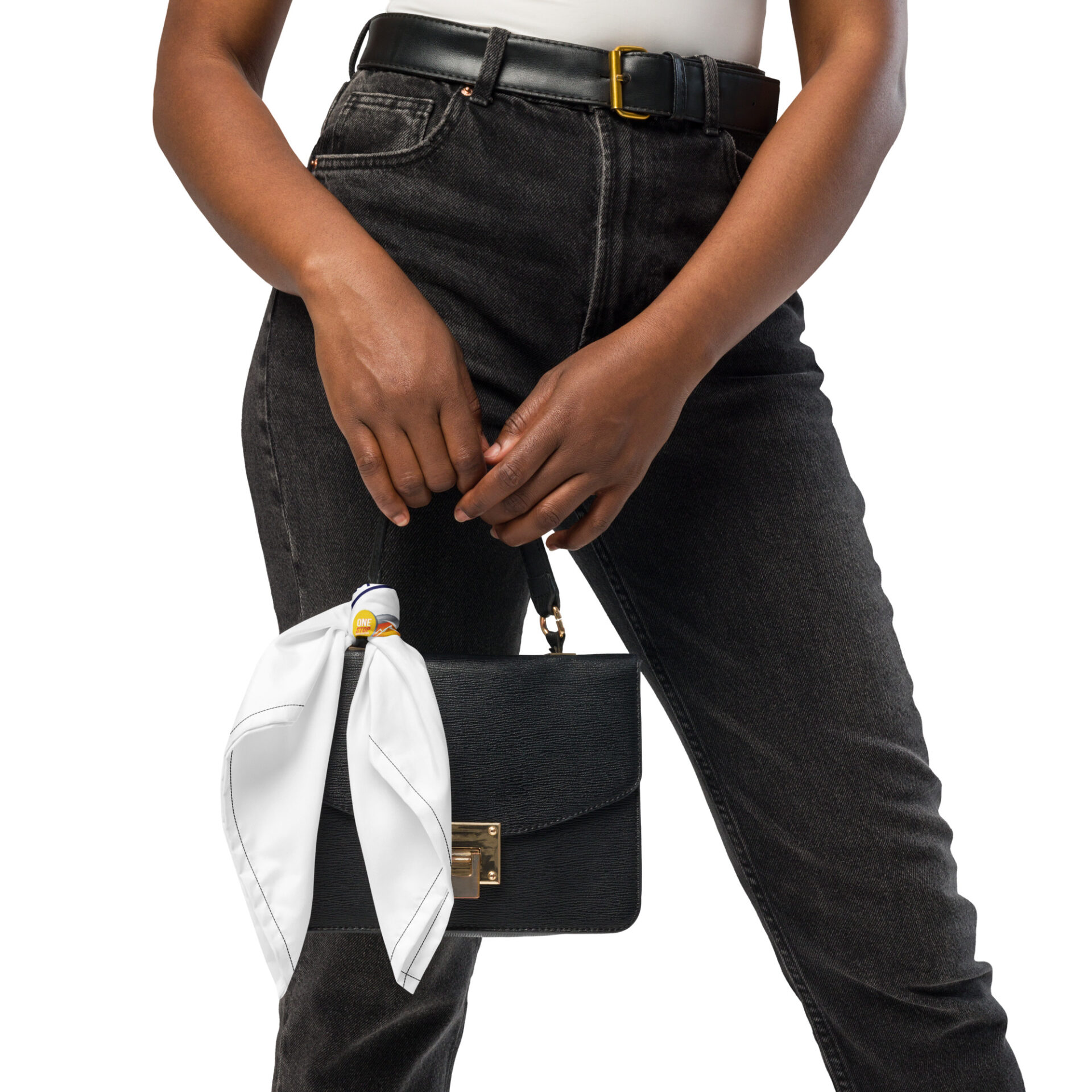 Woman in black jeans holding a black bag.