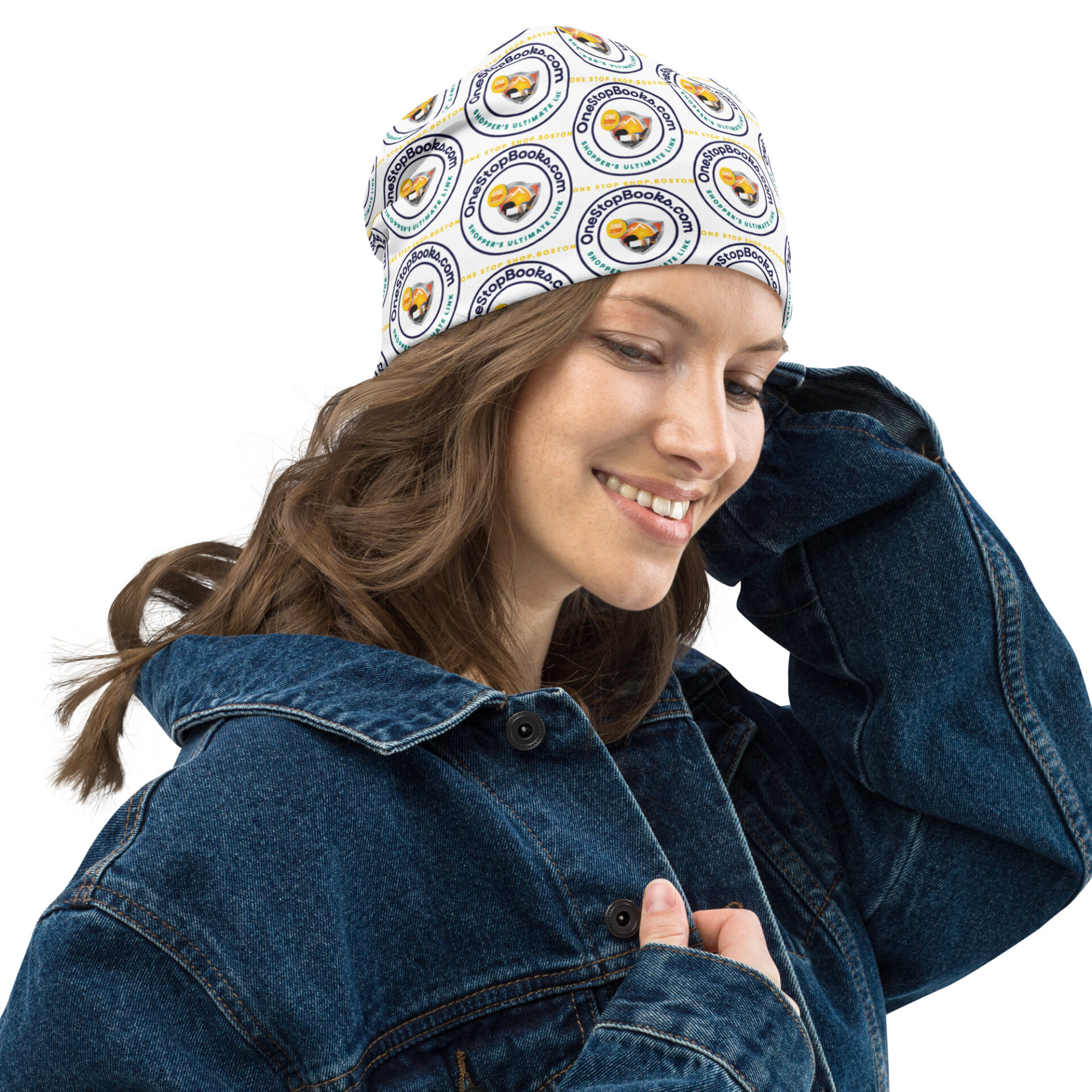 Woman in denim jacket wearing a patterned hat.