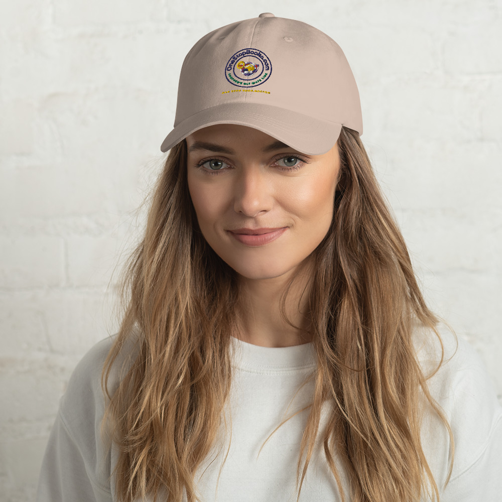Woman wearing a tan baseball cap.