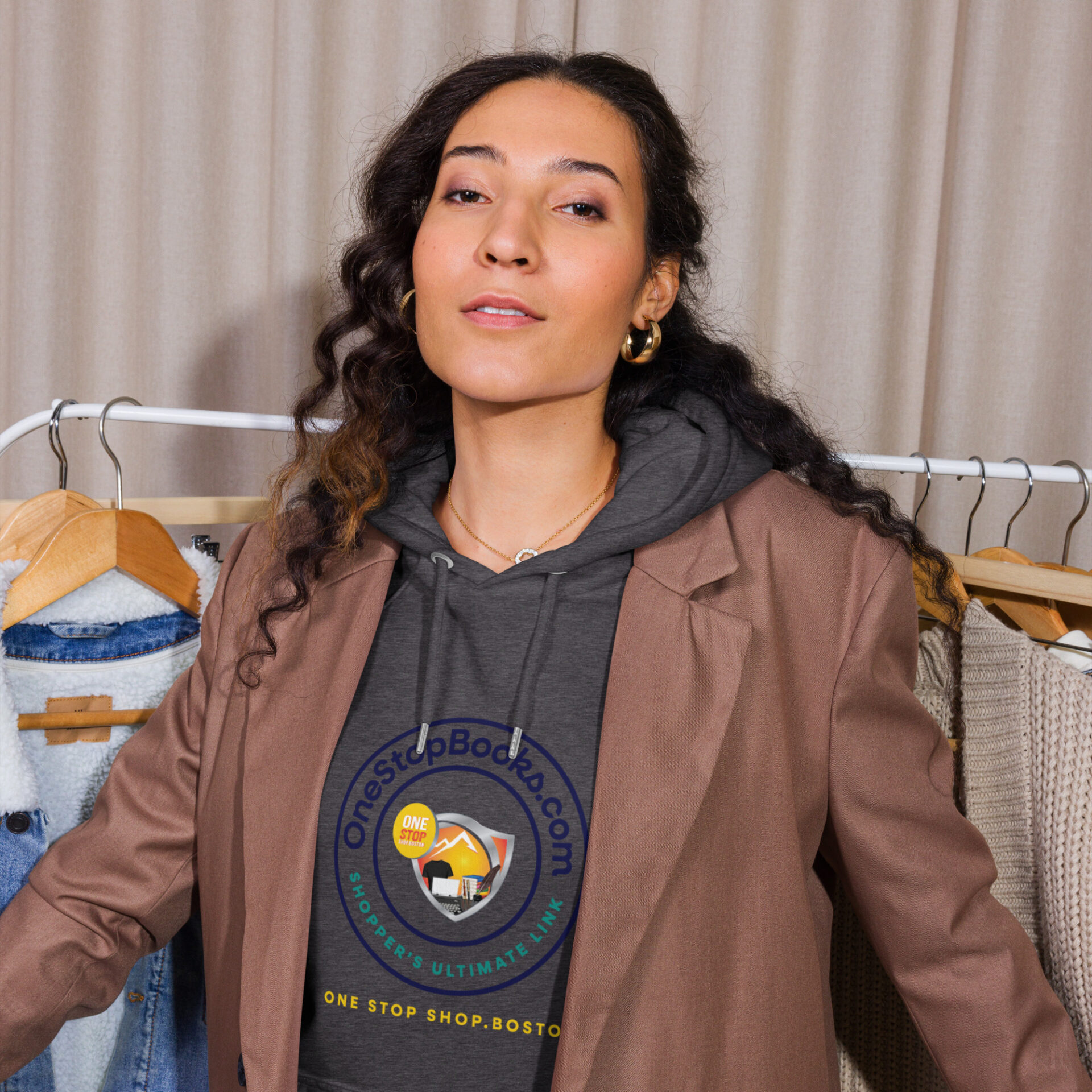 Woman wearing a brown jacket and hoodie.